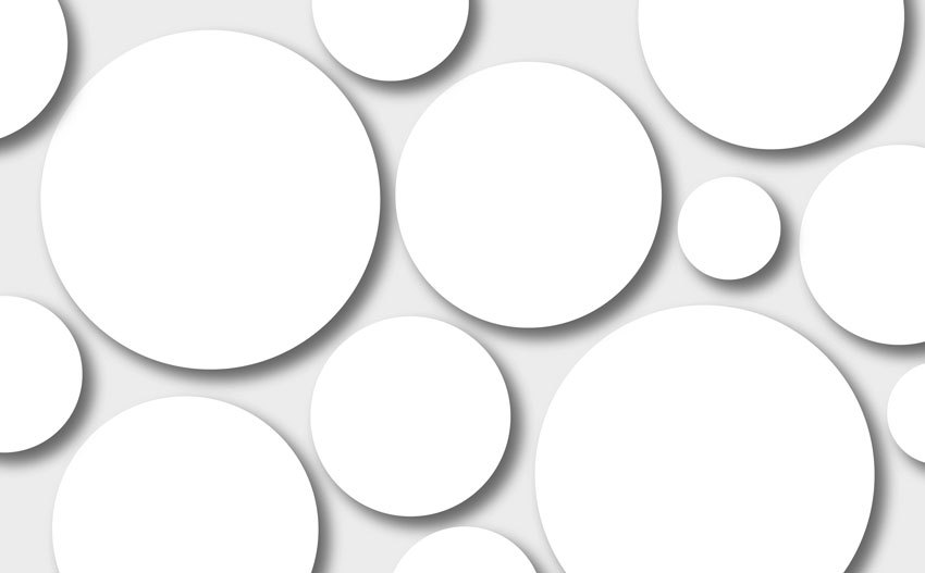 Grafik mit verscjieden großen weißen Kreisen auf hellgrauem Hintergrund